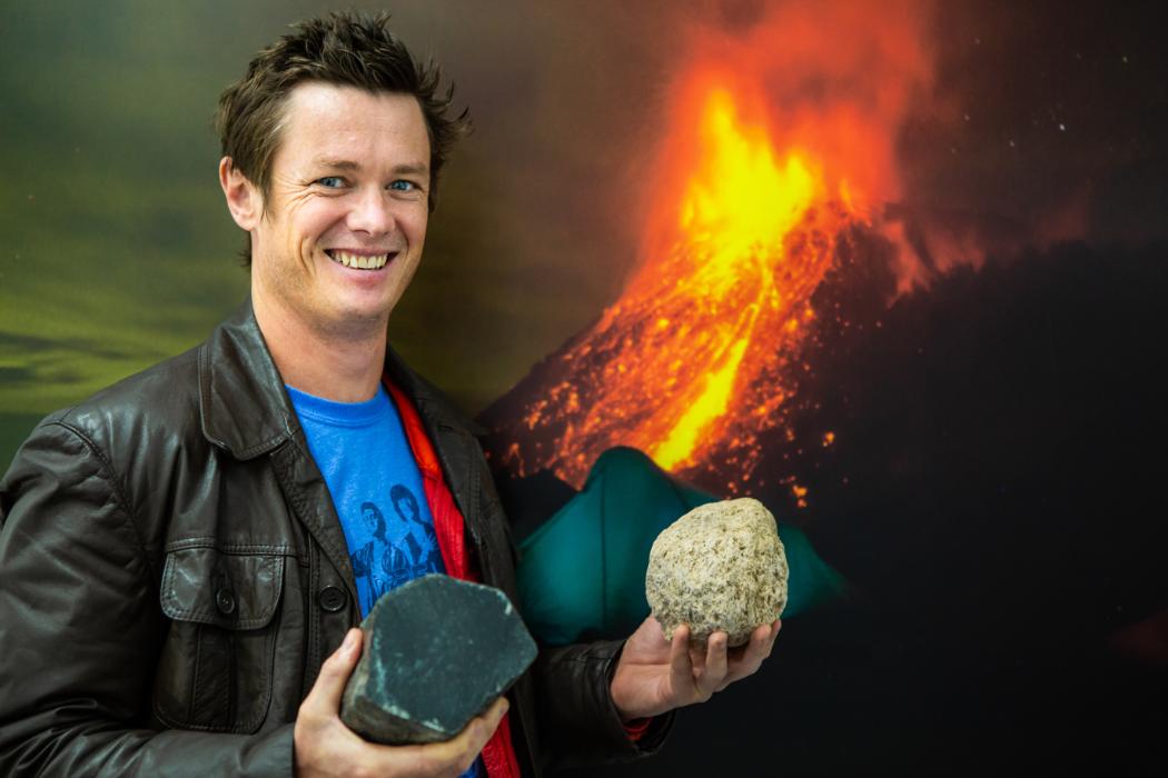 Ben Kennedy Ben Kennedy holding volcanic rock samples.