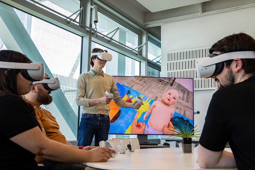 UC HIT Lab NZ students using a VR baby training tool.